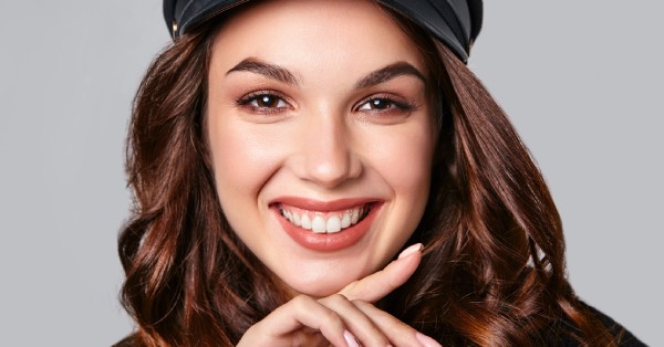 Happy woman with a bright, confident smile highlighting results of cosmetic dentistry in Grand Prairie